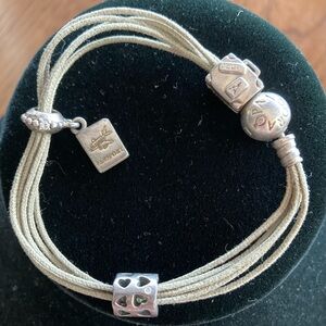 Pandora Bracelet in Multi-Strand leather with 3 authentic silver travel pendants